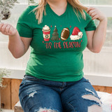 Tis The Season Winter DTF Transfer, Christmas-themed design featuring a holiday coffee cup, Christmas tree, football, and Santa hat with the text 'Tis The Season' on a green T-shirt.