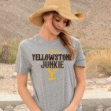 Yellowstone Junkie #2 Screen Print Heat Transfer on a gray T-shirt worn by a woman outdoors.