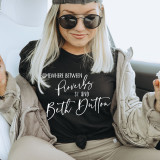 Somewhere Between Proverbs and Beth Dutton Screen Print Heat Transfer, a woman wearing a black t-shirt with white text and sunglasses.