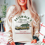 Product Christmas Tree Farm Griswold DTF Heat Transfer, a festive design featuring a tree loaded on a vehicle with holiday text and references to Christmas traditions.