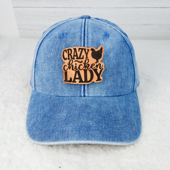 Crazy Chicken Lady Leather Patch, blue denim baseball cap with a leather patch featuring the words 'Crazy Chicken Lady' and a chicken silhouette.