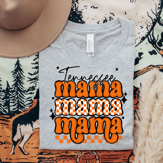 Tennessee Mama DTF Heat Transfer, orange and black themed design on a light grey t-shirt with decorative elements.