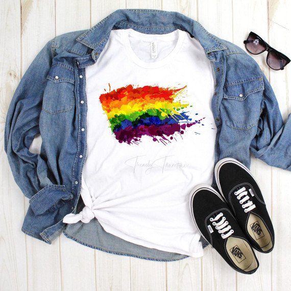 Pride Rainbow Splatter Flag Sublimation Transfer, vibrant rainbow splatter flag design on a white T-shirt with denim jacket, sunglasses, and sneakers.