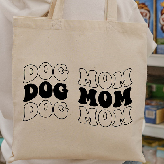 Dog Mom DTF Heat Transfer, reusable tote bag with black and outlined text design.