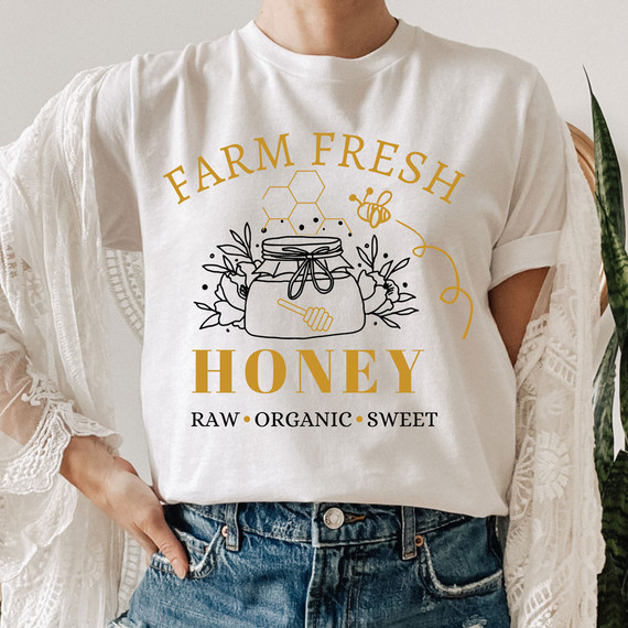 Farm Fresh Honey DTF Heat Transfer, product image showing a white t-shirt with a honey jar design and text promoting organic, raw, and sweet honey.