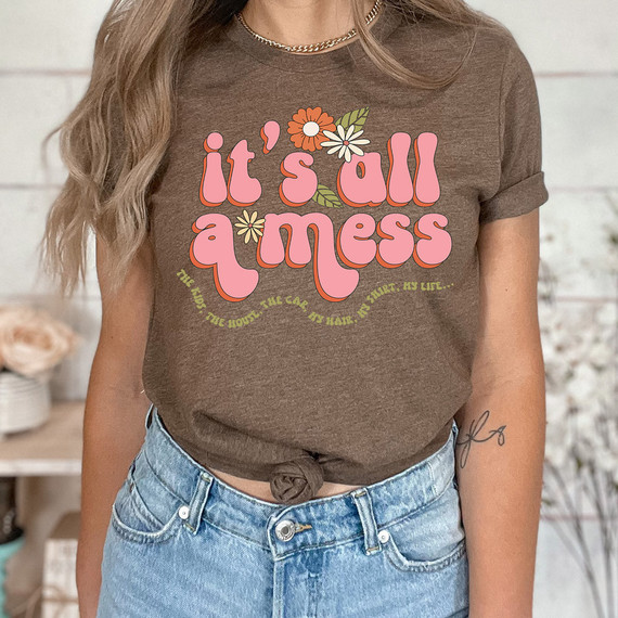 It's All A Mess Floral DTF Heat Transfer, brown t-shirt with a colorful floral design and playful text for casual wear.