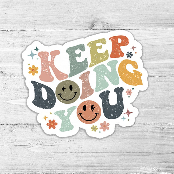 Keep Doing You Die Cut Sticker, colorful motivational sticker with a cheerful design, smiley faces, and floral accents.