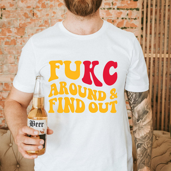 FuKC Around & Find Out DTF Heat Transfer, colorful text on a white t-shirt worn by a person holding a beer bottle.