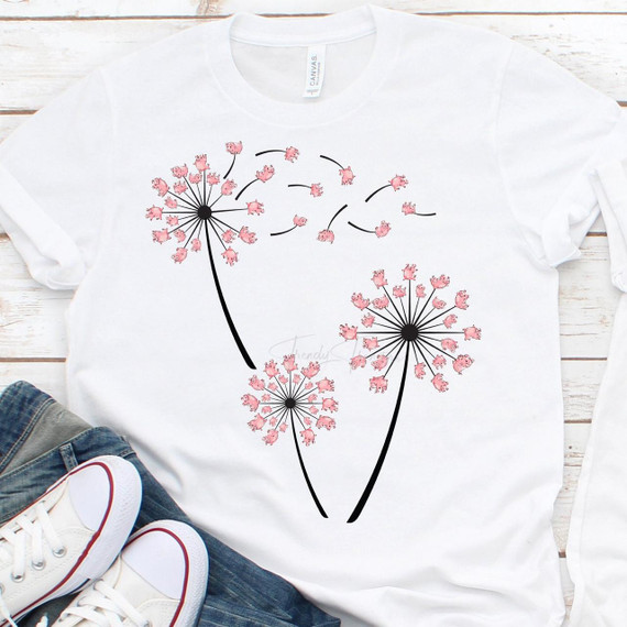 Dandelion Pigs Sublimation Transfer, white t-shirt with a dandelion design featuring pink piglets instead of seeds.
