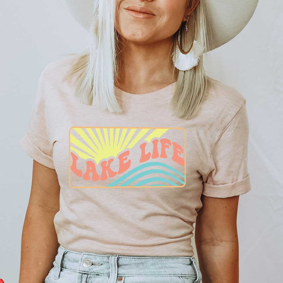 Lake Life Boho DTF Heat Transfer, woman wearing a t-shirt with colorful lake sunset design and text.