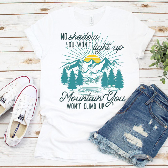 No Shadow You Won't Light Up Mountain You Won't Climb Up sublimation transfer T-shirt, white T-shirt with mountain and pine tree design and inspirational quote.