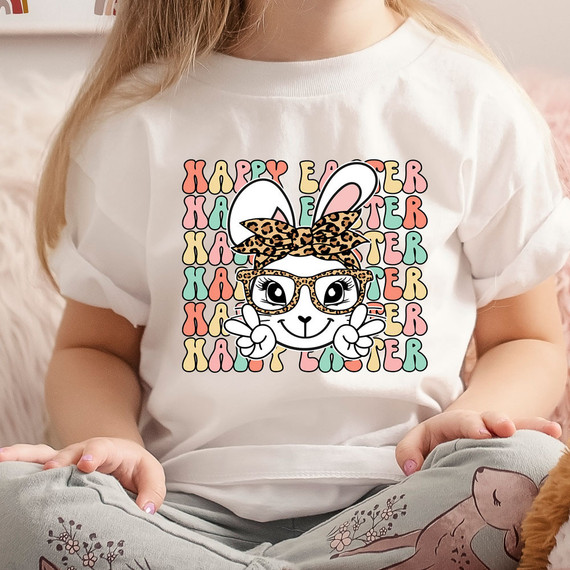 Happy Easter Boho Bunny DTF Heat Transfer, adorable cartoon bunny wearing leopard print glasses and a bow, surrounded by pastel-colored Happy Easter text in the background.