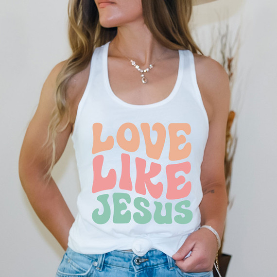 Love Like Jesus Sublimation Transfer, a colorful design featuring the words 'Love Like Jesus' in pastel shades on a white tank top.