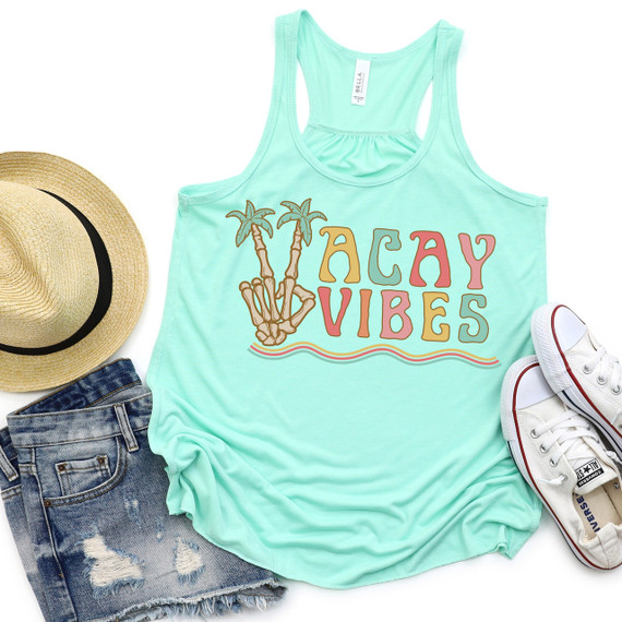Vacay Vibes DTF Heat Transfer, mint green tank top with a graphic design of a hand making a peace sign with two palm trees and the words 'Vacay Vibes' in colorful letters.