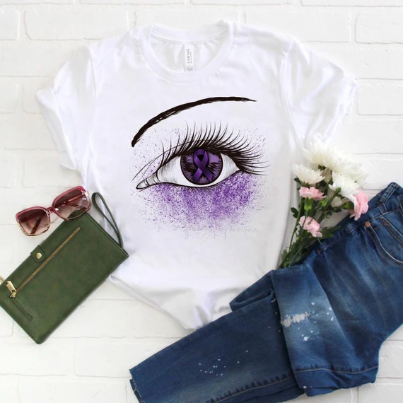 Purple Ribbon Awareness Glitter Eye Sublimation Transfer on a white t-shirt with an artistic eye design featuring a purple ribbon symbol.