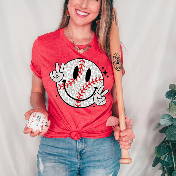 Leopard Retro Baseball Happy Face DTF Heat Transfer, a fun graphic of a smiling baseball with leopard print pattern, peace signs on both hands, and a playful expression.