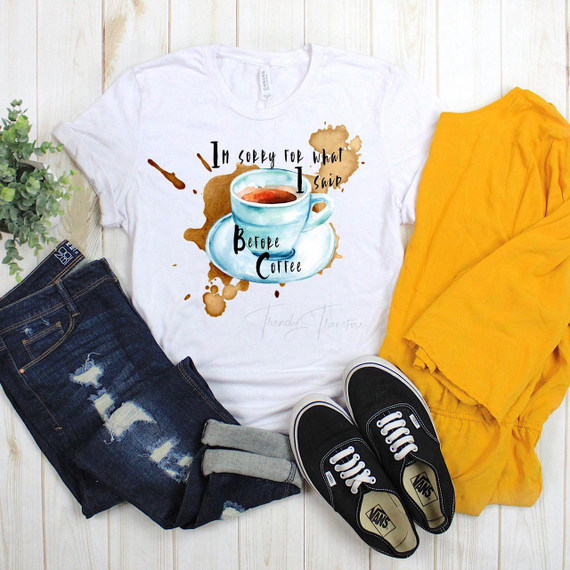 Sorry For What I Said Before Coffee Sublimation Transfer T-Shirt, white T-shirt with a colorful coffee cup and splash design and humorous text.