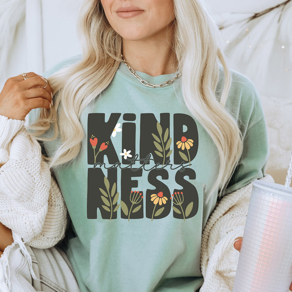 Kindness Matters Boho DTF Heat Transfer, person wearing a green sweatshirt with a floral 'Kindness Matters' design.