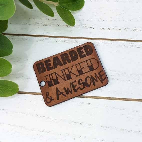 Bearded, Inked, & Awesome Leather Keychain, leather keychain with engraved text and holes for attachment.