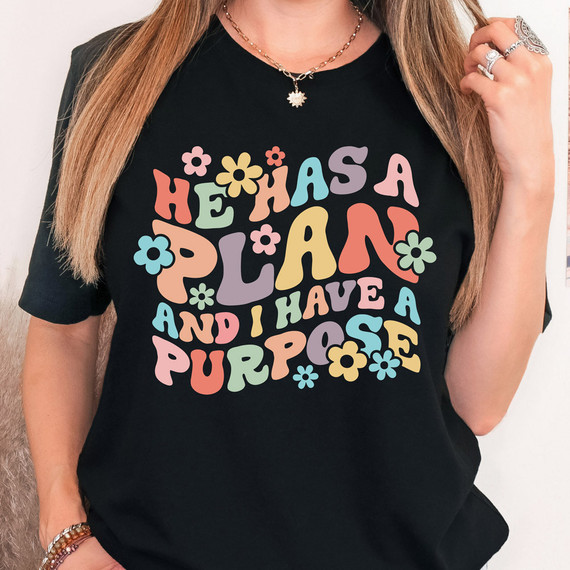 He Has A Plan And I Have A Purpose DTF Heat Transfer, colorful floral text design on a black t-shirt.