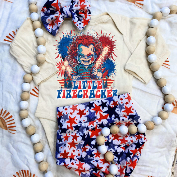 Little Firecracker DTF Heat Transfer, colorful fireworks and Child's face design on a t-shirt with patriotic colors.
