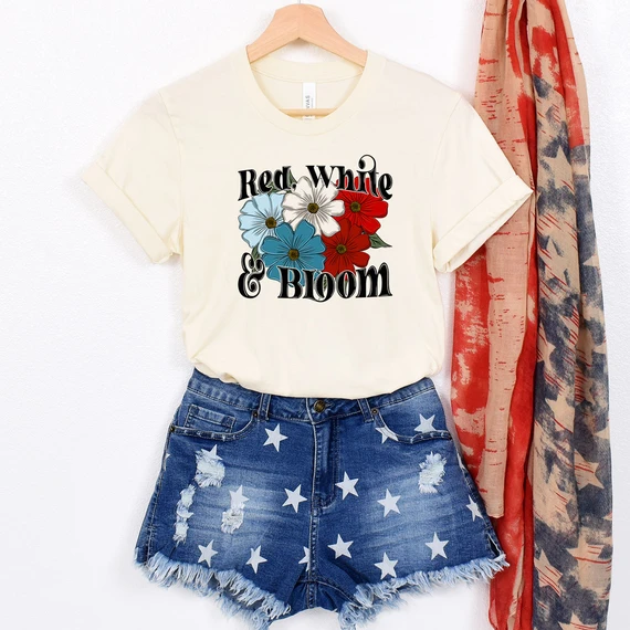 Red, White And Bloom BLACK DTF Heat Transfer on a white t-shirt with a floral design and text.