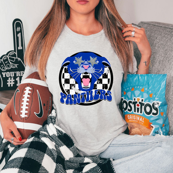 Panthers Mascot DTF Heat Transfer, blue panther mascot graphic with checkered background and star-shaped sunglasses on a woman's t-shirt.