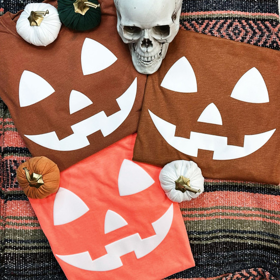 Jack-O-Lantern WHITE PUFF Screen Print Heat Transfer, Halloween-themed white pumpkin face design on fabric, ideal for decorating clothing or accessories for Halloween.