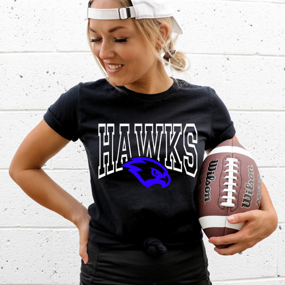 Hawks Custom Color Options DTF Heat Transfer featuring a woman wearing a black T-shirt with Hawks logo and holding a football.