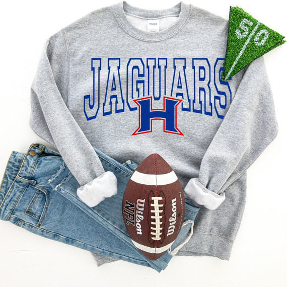 Jaguars H DTF Heat Transfer, image of a grey sweatshirt with the Houston Jaguars logo and name, alongside a football and a green textured fabric piece.