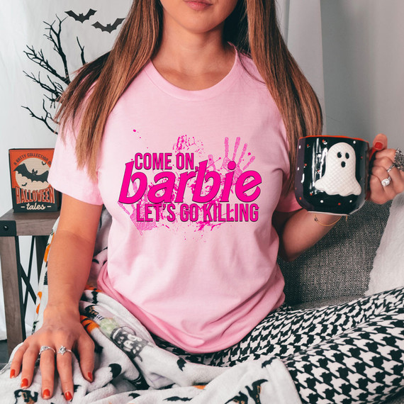 Come On Barbie Let's Go Killing DTF Heat Transfer, pink T-shirt with Halloween-themed text and graphics.