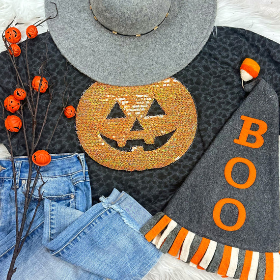 Sequins Pumpkin Patch, Halloween-themed black shirt with a glittery orange pumpkin face design.
