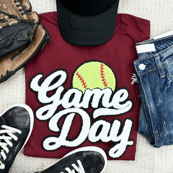 Softball White Game Day Chenille Patch, white and yellow softball design with 'Game Day' text on maroon T-shirt.