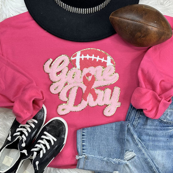 Gold Glitter Breast Cancer Game Day Chenille Patch, pink and gold pink ribbon design with football and 'Game Day' text on a pink shirt.