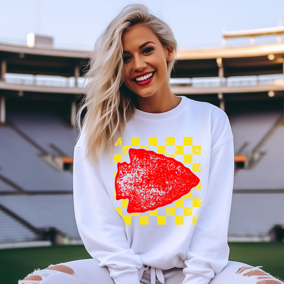 Arrowhead YELLOW/RED DTF Heat Transfer, colorful graphic design on a white sweatshirt worn by a smiling woman.
