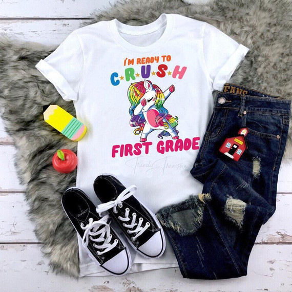 Back To School Dabbing Unicorns First Grade Sublimation Transfer, colorful unicorn cartoon on a white T-shirt with the text 'I'm Ready to Crush First Grade'.