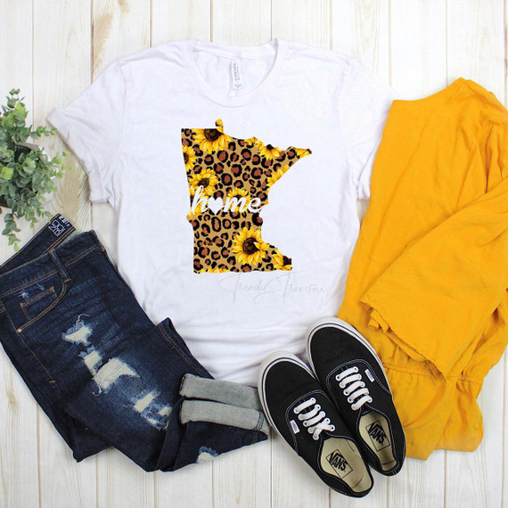 Minnesota Leopard Sunflower home Sublimation Transfer, displayed on a white t-shirt along with jeans, yellow jacket, and black Vans sneakers.