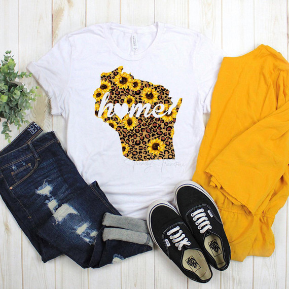 Wisconsin Leopard Sunflower home Sublimation Transfer, custom T-shirt with sunflower and leopard print design featuring the state of Wisconsin, clothes laid out with jeans, sneakers, and a yellow jacket.