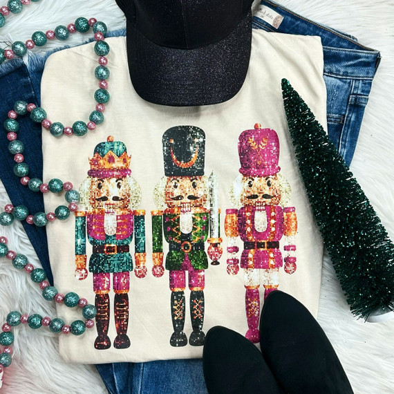 Nutcracker Faux Sequins Screen Print Heat Transfer, colorful nutcracker soldiers with sparkly sequin design on a t-shirt.