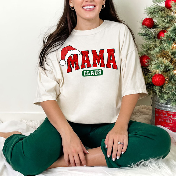 Mama Claus Leopard DTF Heat Transfer, Christmas-themed heat transfer design featuring Santa hat, red and green text, and leopard pattern for holiday apparel.