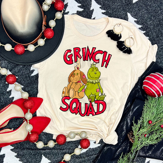 Green Guy Squad Stuffies DTF Heat Transfer, festive holiday themed shirt with cartoon monster characters and the text 'GRINCH SQUAD' surrounded by Christmas decorations.
