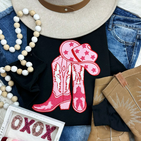 Boots + Hat Chenille Patch, pink cowboy boots and hat embroidered patch on black fabric.