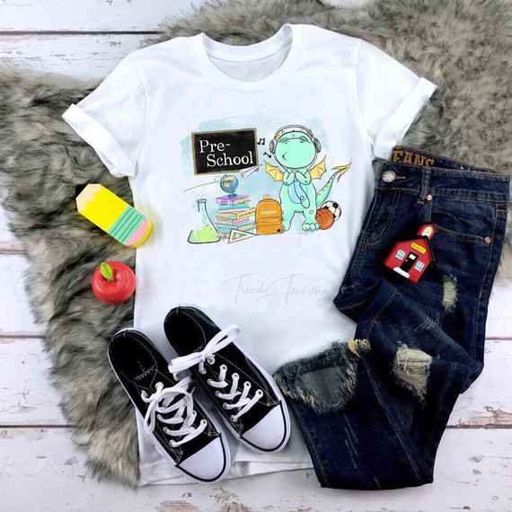 Back To School Dragon Blue Pre School Sublimation Transfer T-shirt with cartoon dragon, school supplies, and backpack design.