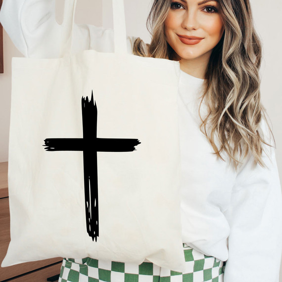 Distressed Cross BLACK DTF Heat Transfer, black cross design on a white tote bag.