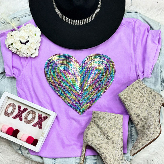 RAINBOW HEART Sequin Patch, colorful rainbow heart design made of shimmering sequins on a purple t-shirt.