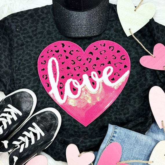 Leopard Love Sequin Heart Chenille Patch, vibrant pink heart-shaped patch with leopard print accents and the word 'love' embroidered in white with sparkly details.