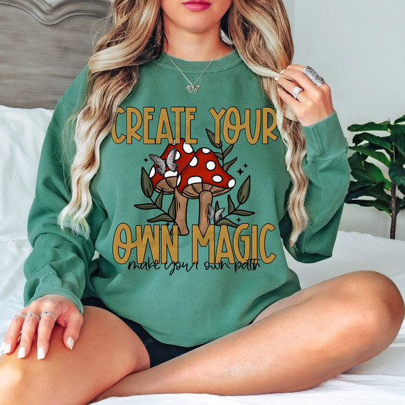 Create Your Own Magic Make Your Own Path DTF Heat Transfer image of a woman wearing a green sweatshirt with a motivational mushroom design.