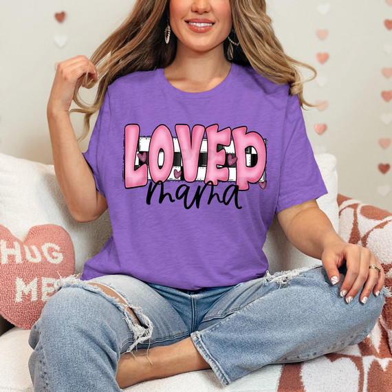 Loved Mama DTF Heat Transfer, pink and black lettering design on a purple T-shirt with hearts for moms.