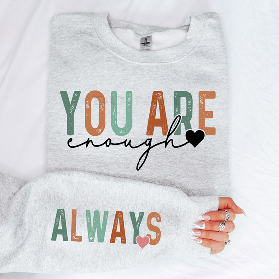 You Are Enough SET DTF Heat Transfer, text on a grey sweatshirt with colorful and cursive design.