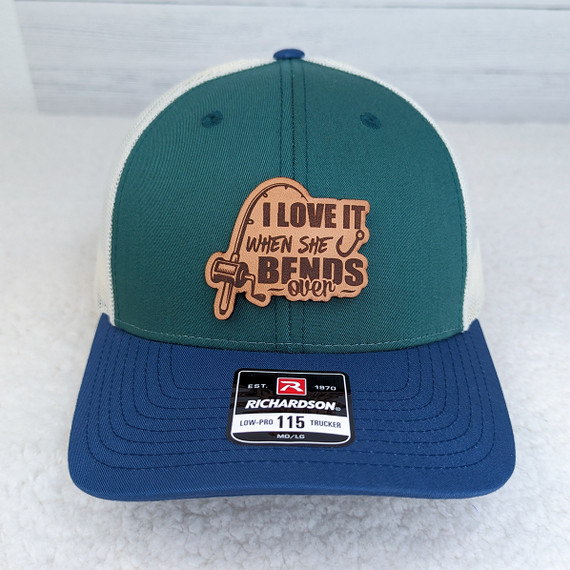 I Like It When She Bends Over Leather Hat Patch, embroidered patch with a fishing hook design and humorous phrase.